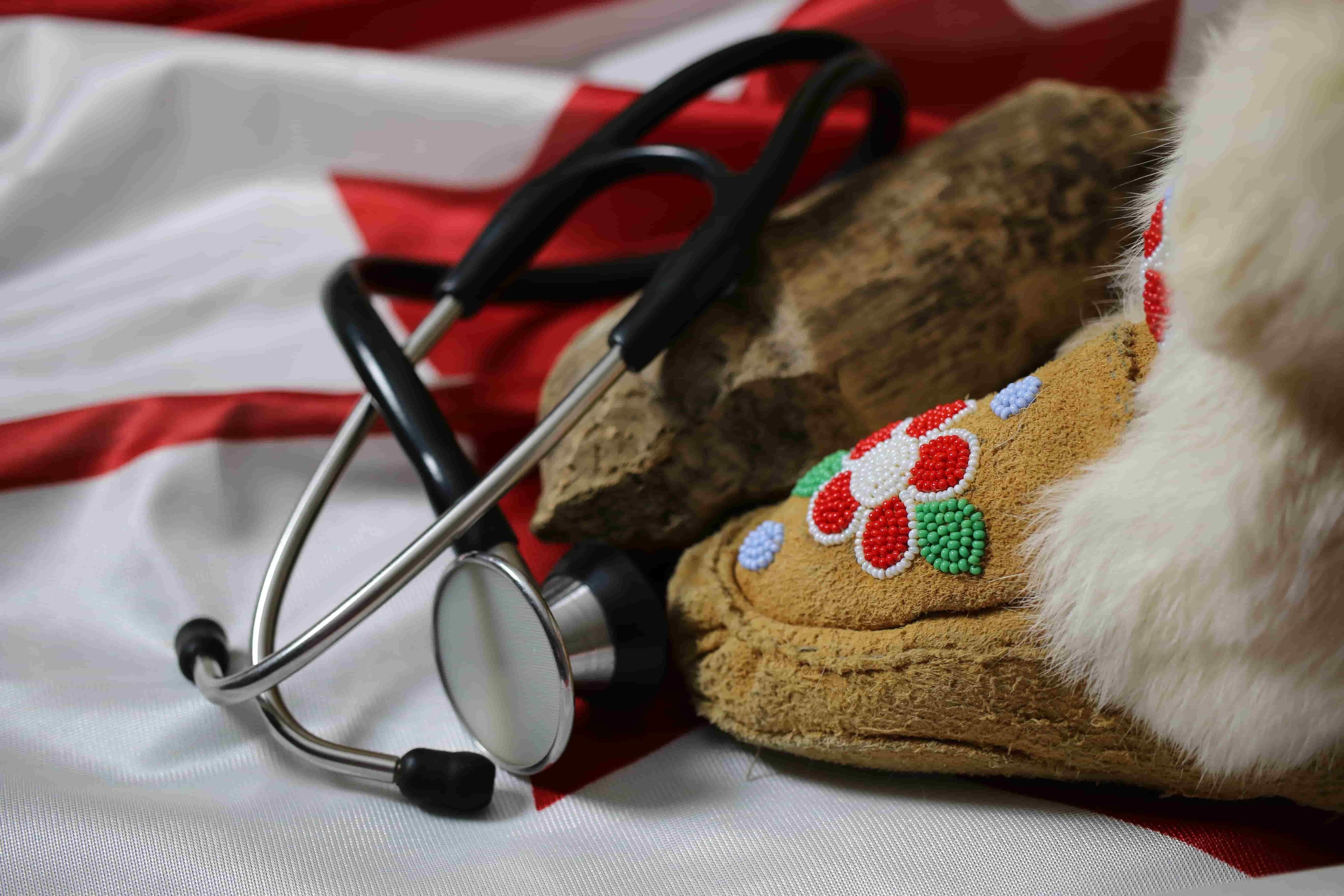 Aboriginal Peoples health, symbolized by moccasins and a medical stethoscope